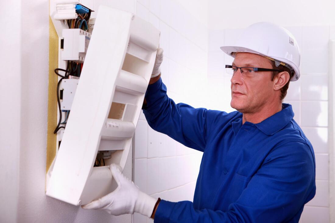 man upgrading electrical panel